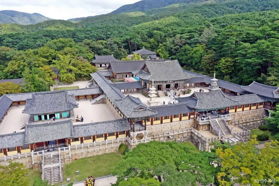 Overhead view of Bulguksa Temple's layered courtyards and surrounding woodland