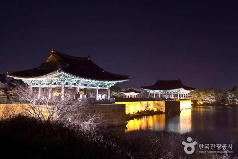 Donggung Palace pavilions and pond edge illuminated on a winter night