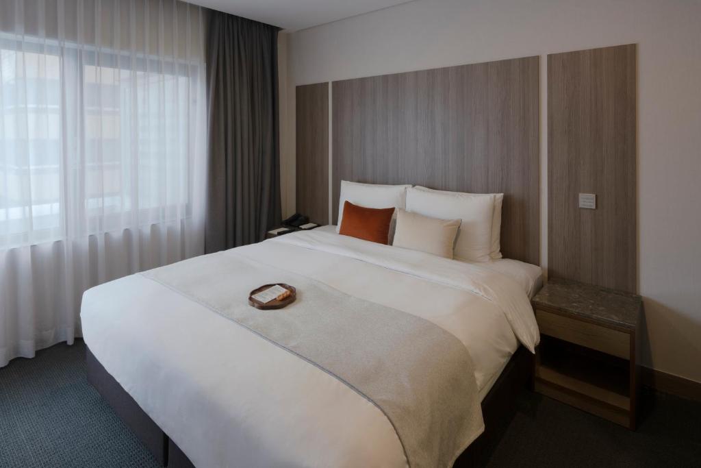 AMID Hotel Seoul 客房雙人床